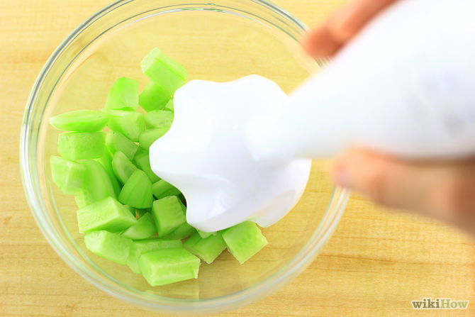 4. Place the cucumber chunks into a food processor or blender. You should leave a couple of inches in between the top cucumber pieces and the rim of the machine. Do not fill the food processor to the top.
