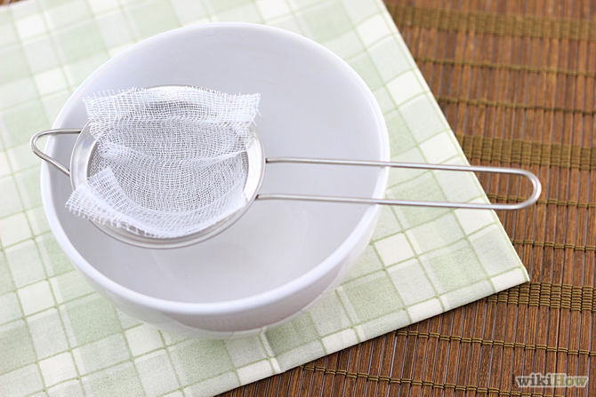 7. Place cheesecloth inside the strainer. The cloth will allow you to strain out more pulp. You can also line the strainer with coffee filters to create the same effect.